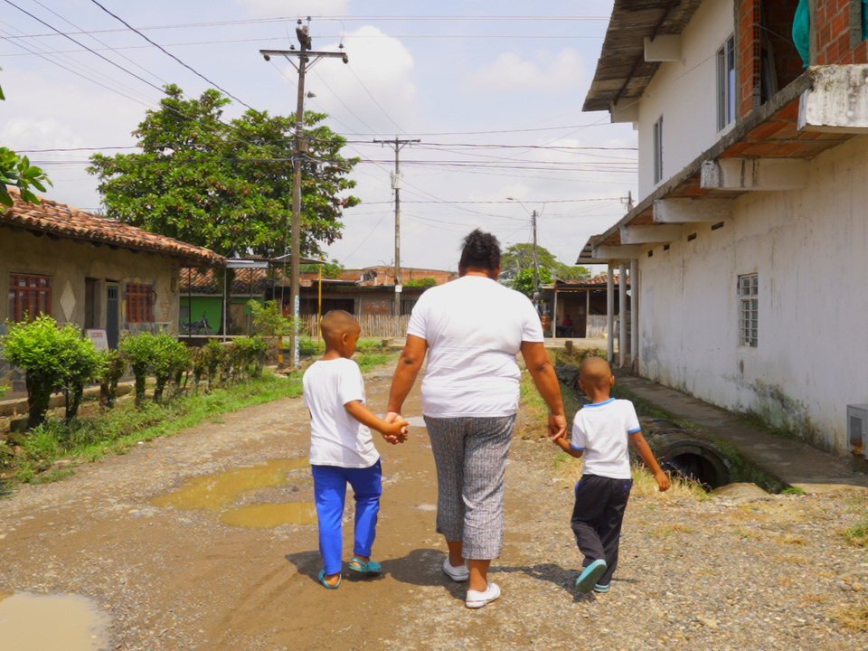 Family walking down a road.