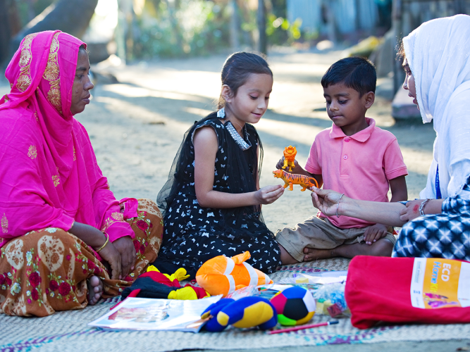 Mothers and children playing.