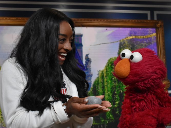 Simone Biles and Elmo.