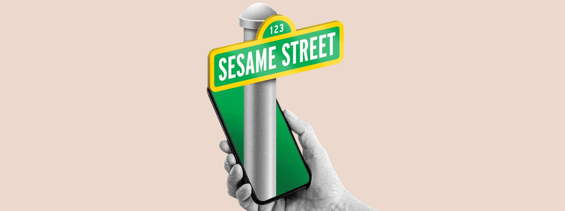 hand holding a phone in front of the Sesame Street sign.