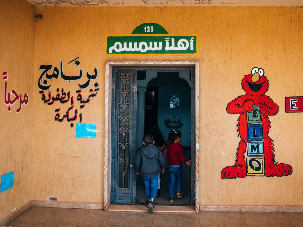 Children walking in to a school.