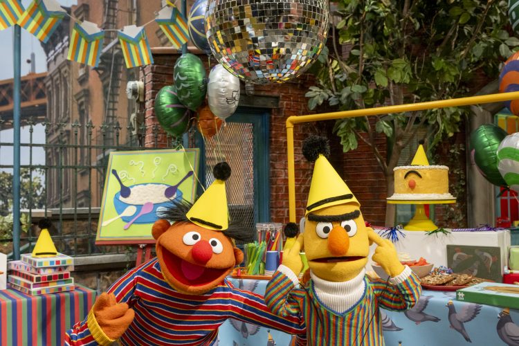 Ernie and Bert in party hats.