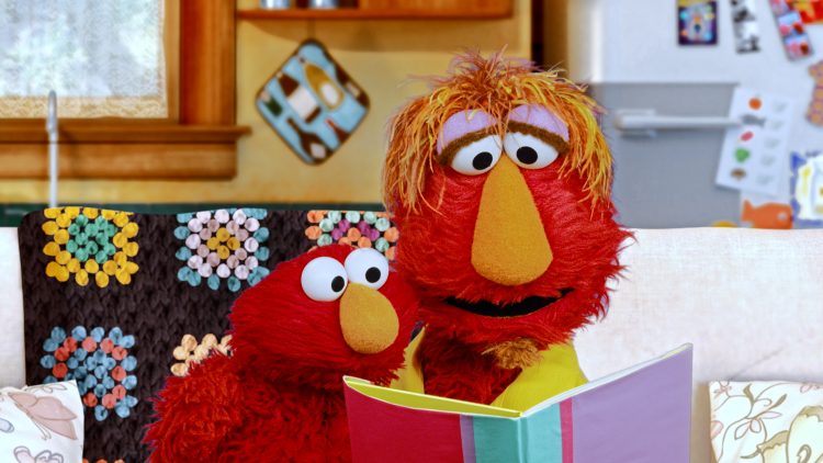 Elmo and Louie read a book