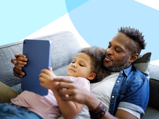 A parent and child looking at a tablet.