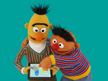 Bert and Ernie on a tablet.