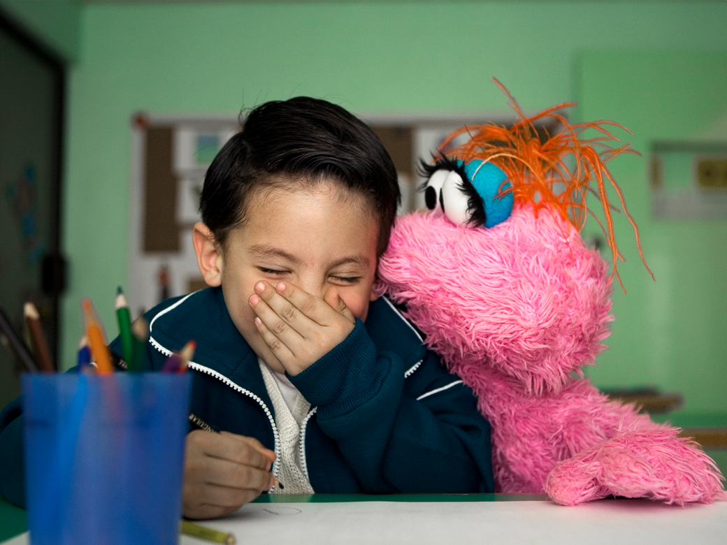 Lola and a Child laughing.