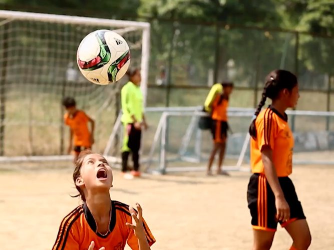 Children playing soccer.