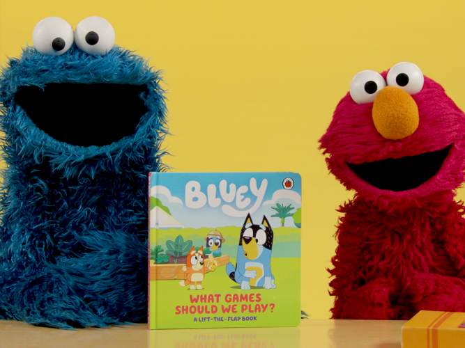Cookie Monster, Elmo and a Bluey book.