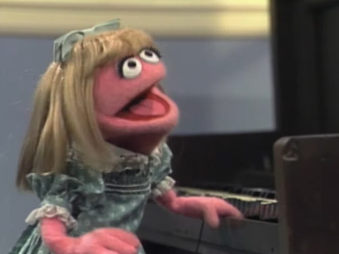 Prairie Dawn at a piano.