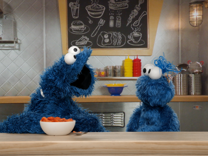 Cookie Monster and his niece trying new food.
