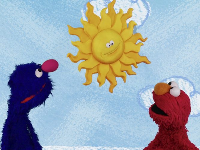 Elmo and Grover talking to the sun.
