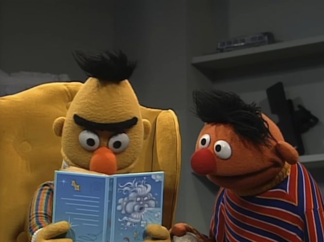 Bert and Ernie reading.