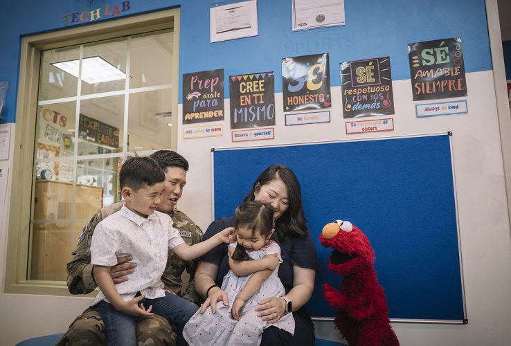 Elmo with a military family.