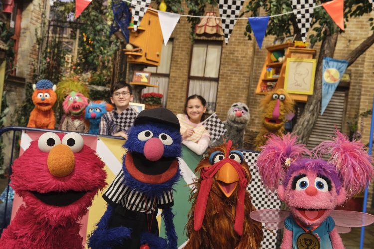 Elmo, Abby, Grover and a chicken.