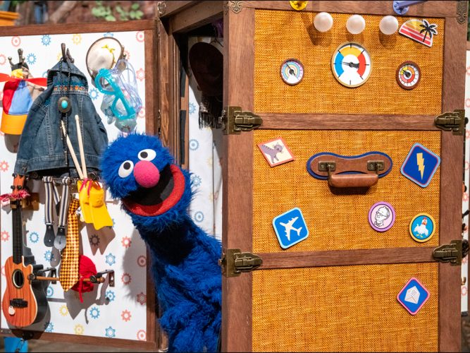 Grover and a large suitcase.