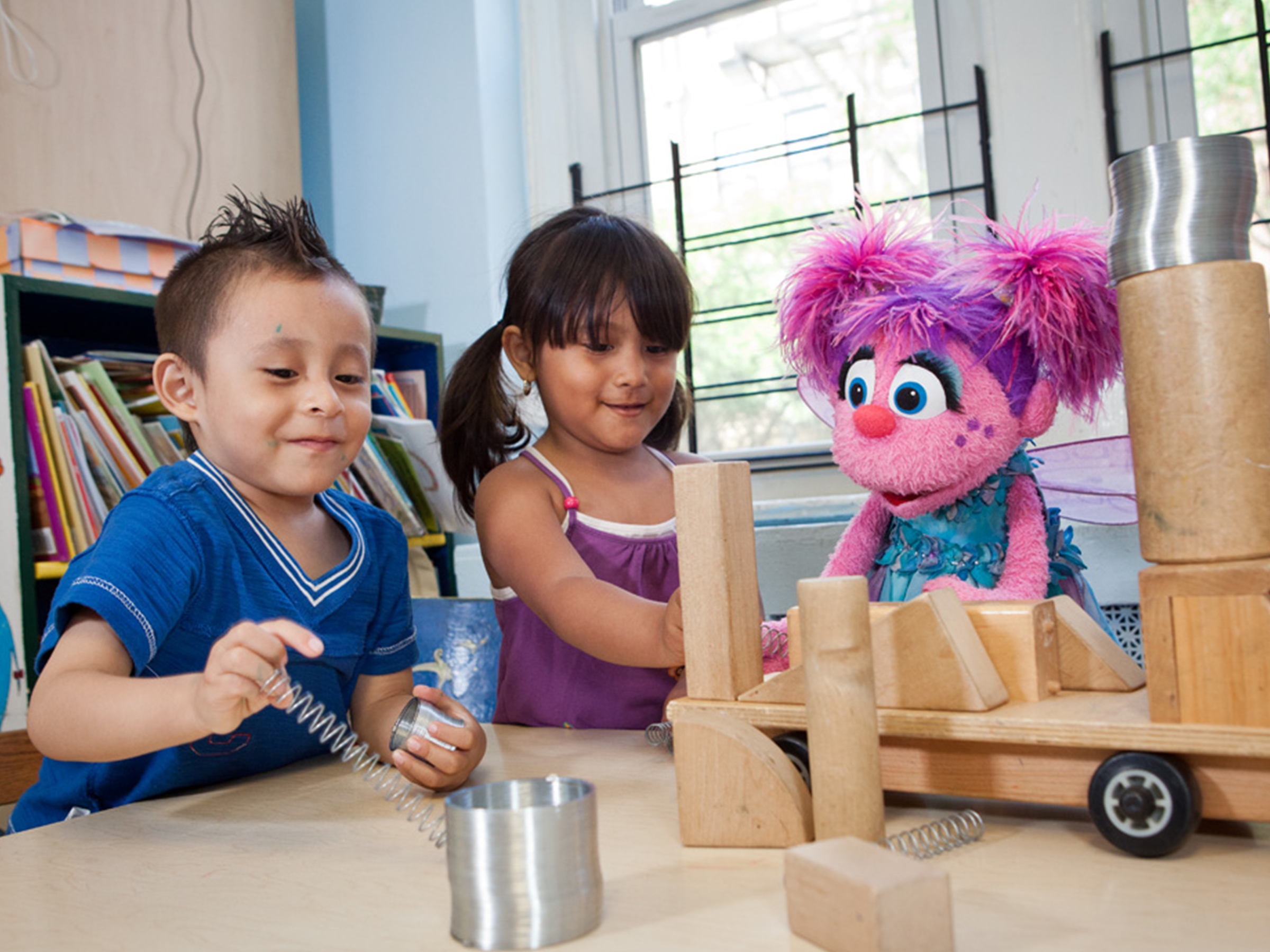 Abby playing blocks with children.