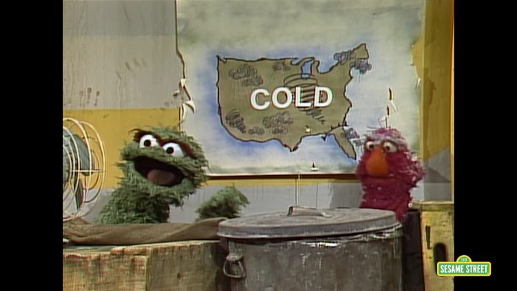Oscar and Telly in front of a cold weather report.