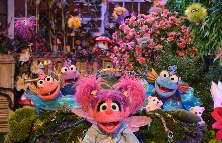 Abby in the magical garden with baby dragon beasties.