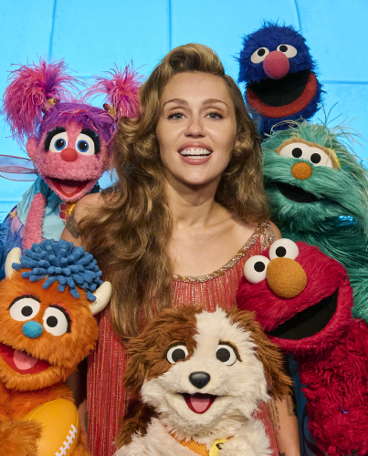 Miley Cyrus with Sesame Street Characters