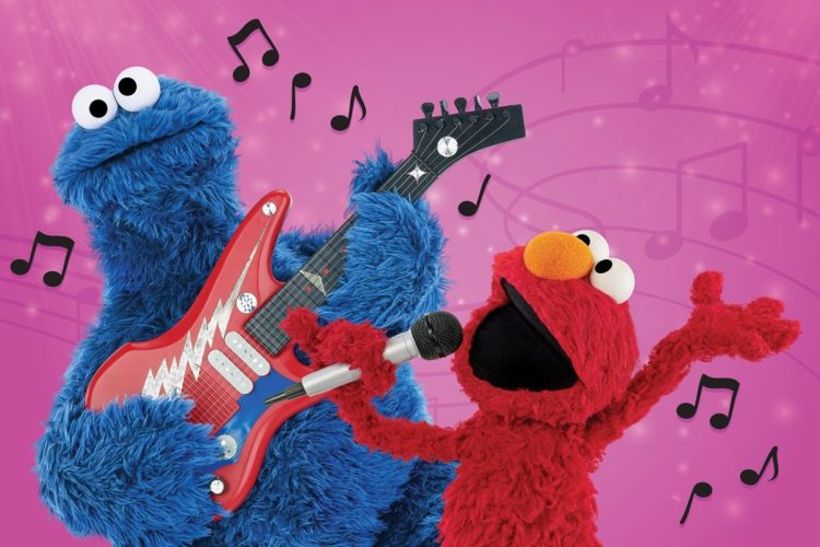Cookie Monster playing the guitar and Elmo