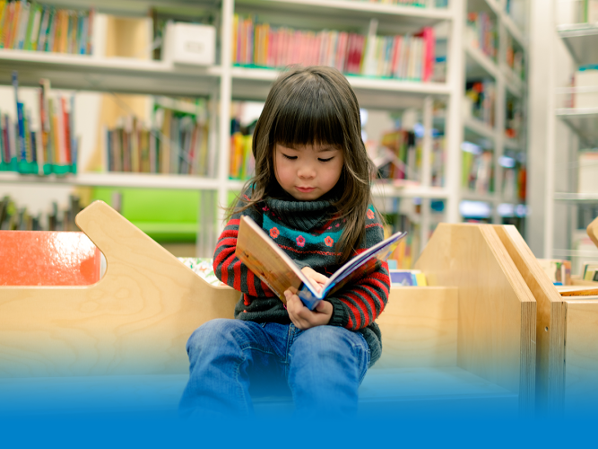 child holding a book
