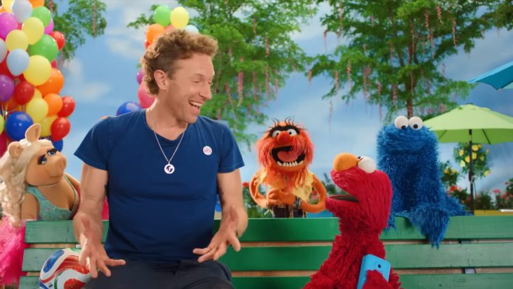 Chris Martin with Sesame characters