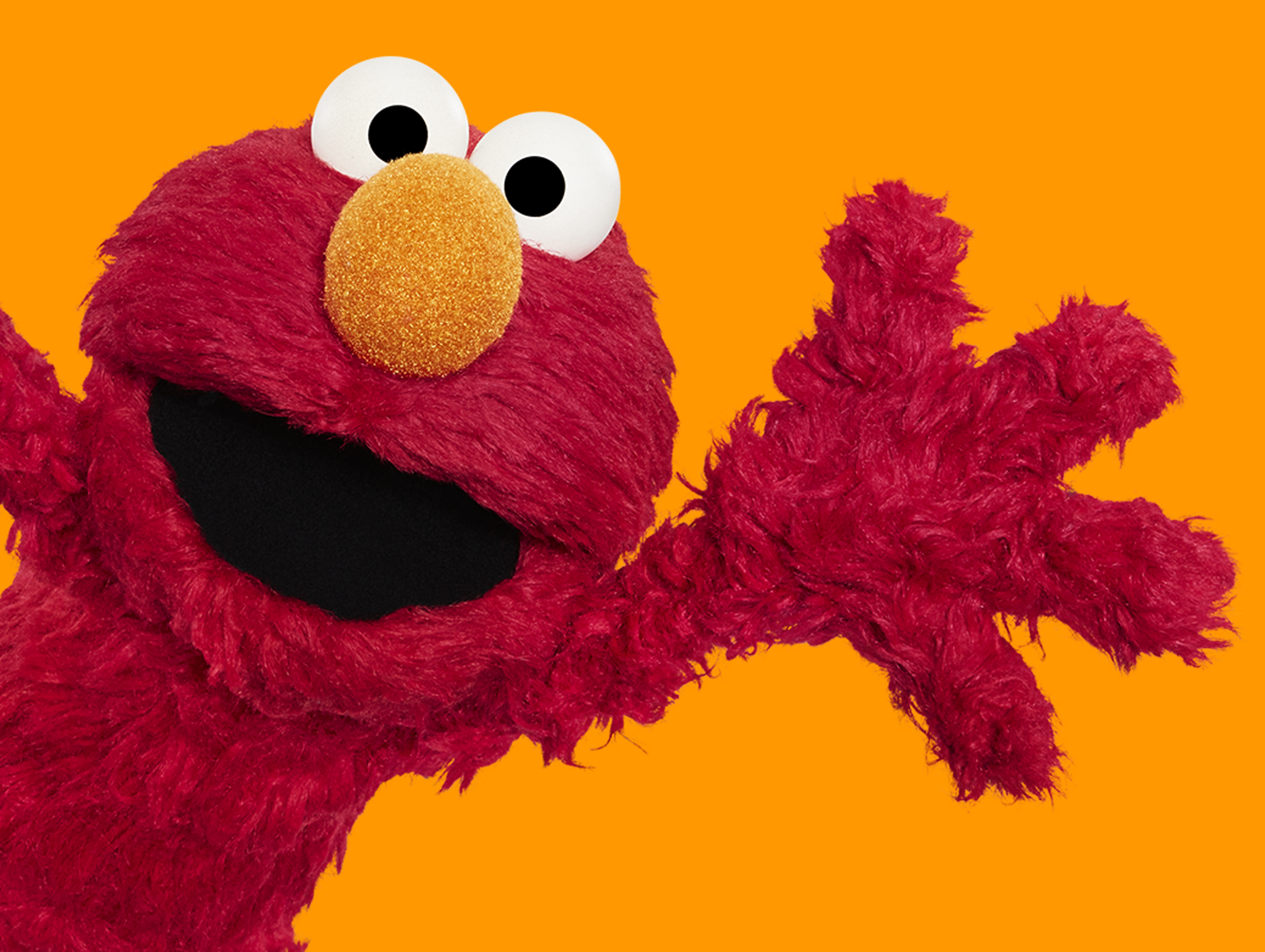 Elmo waving.