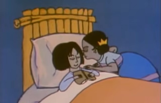 A mother tucking her child into bed