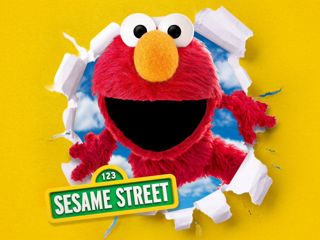 Elmo with the street sign
